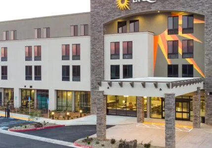 Completed hotel rebuild project showing a fully renovated exterior with modern design, upgraded systems, and improved guest accessibility after a complete commercial building reconstruction