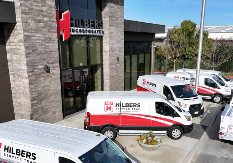 Hilbers Service Team vans parked outside the Hilbers Incorporated office in Yuba City, California.